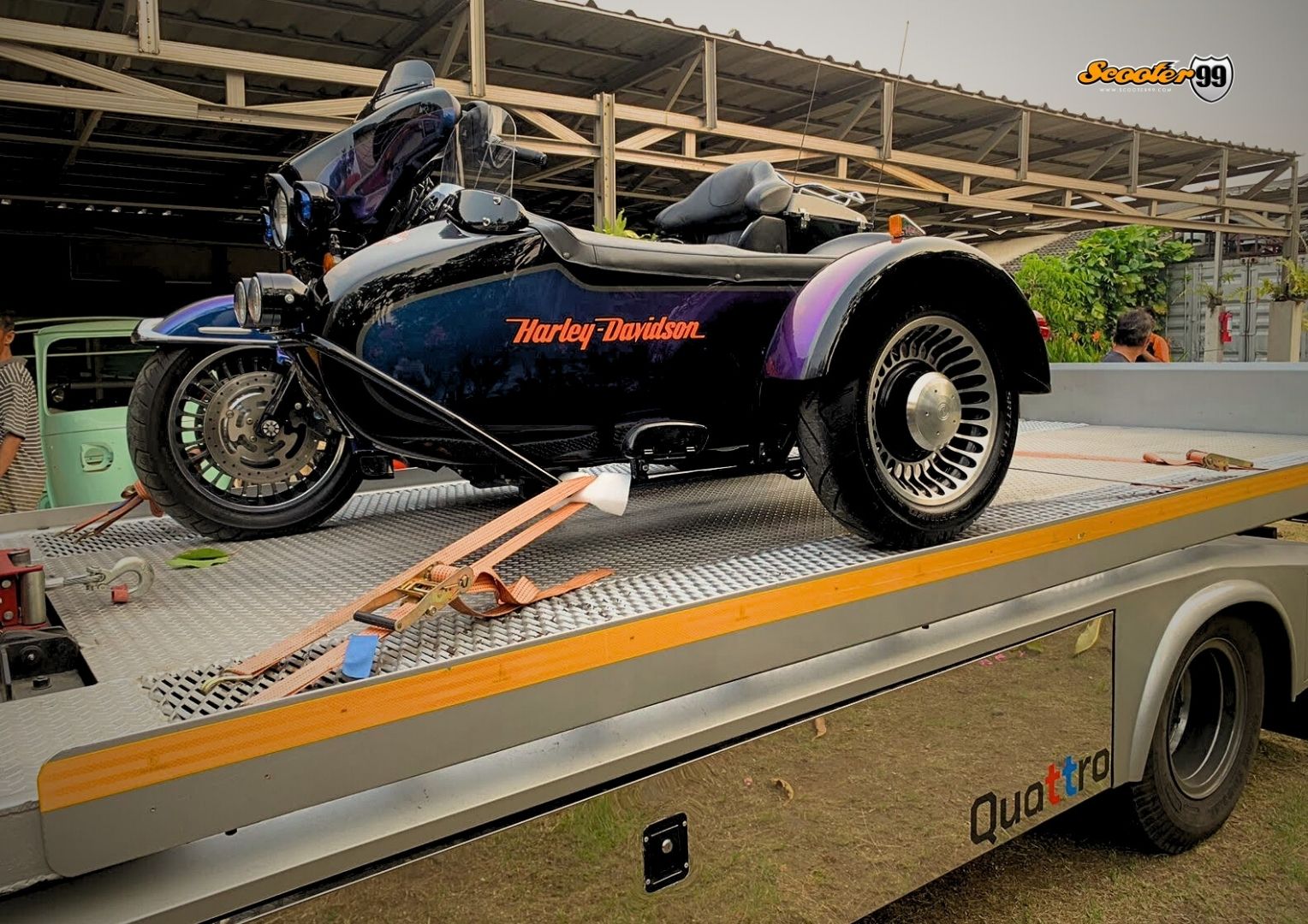 Towing truck in action, securing a vehicle on the roadside